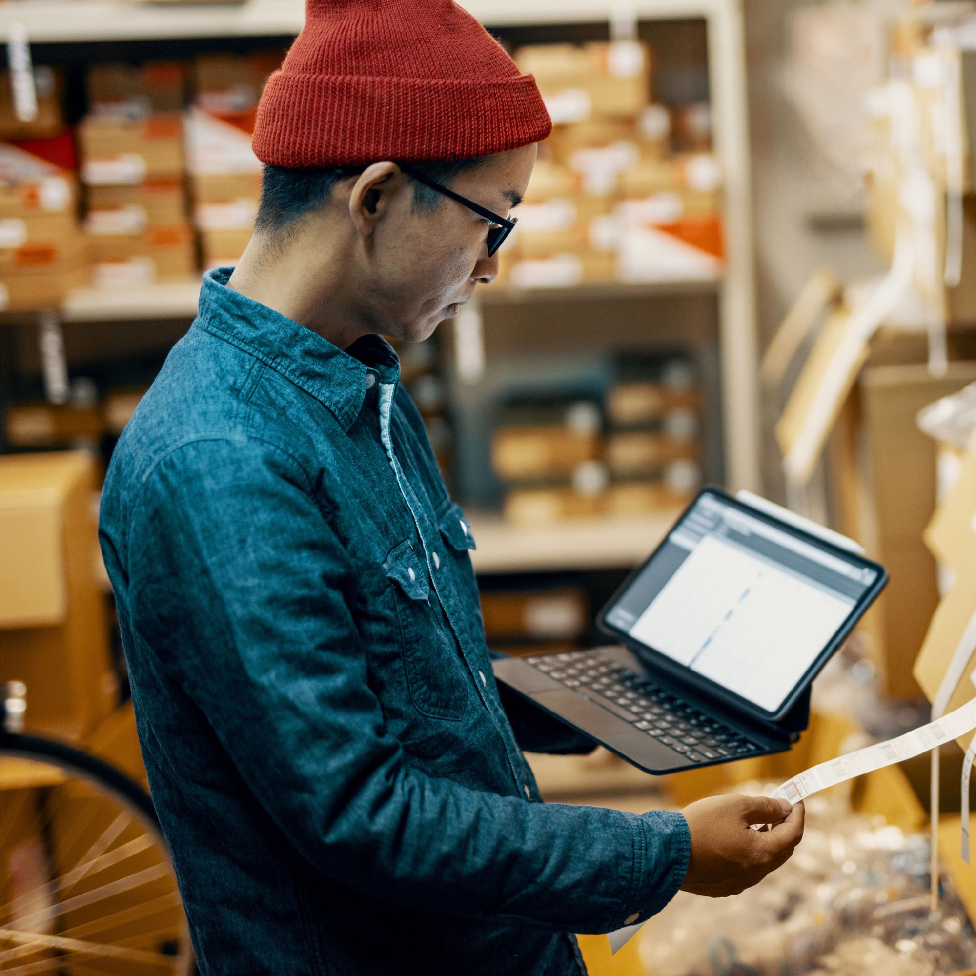 Employee reviewing purchase data across procurement spend categories.